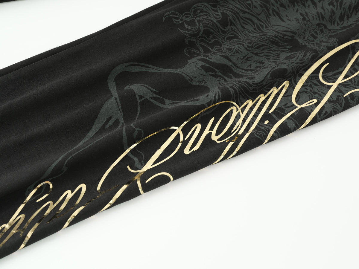 Black fabric with a metallic gold cursive script and a dark gray horse graphic, shown on a white background.